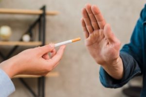 smoker refusing cigarette