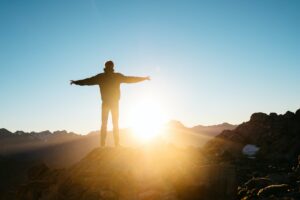 Man on top of mountain